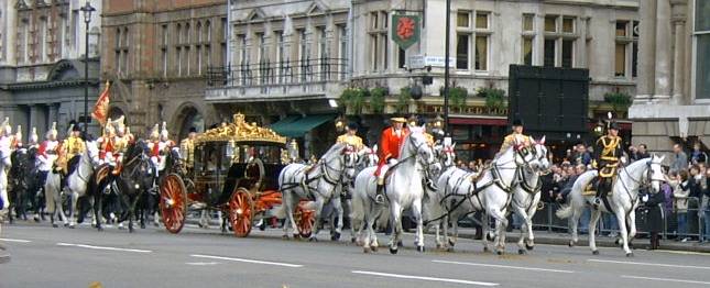 The Irish  State Coach passes in procession along Whitehall towards The Houses of Parliament